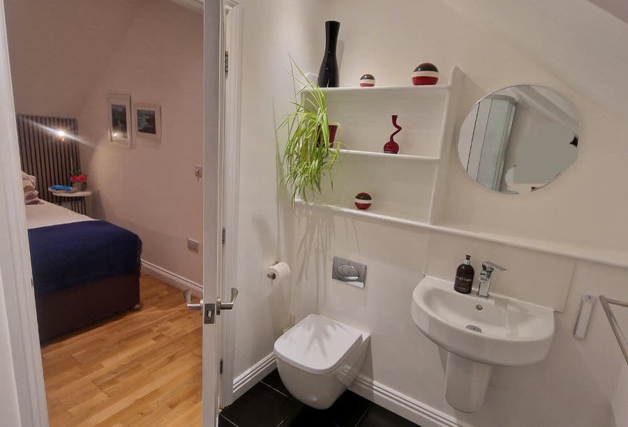 Ensuite bathroom, with the bedroom beyond